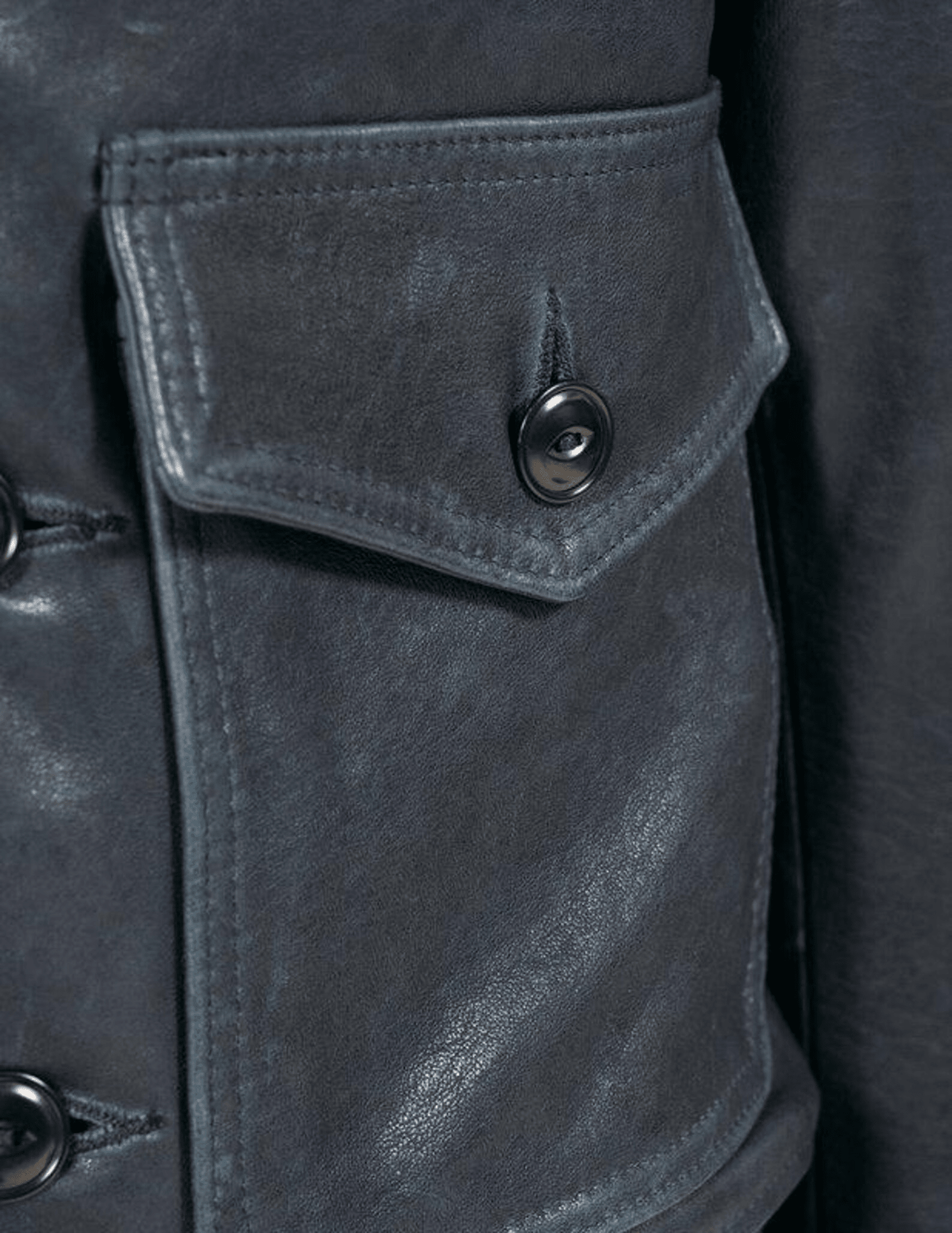 Close-up of a dark gray leather jacket with a buttoned pocket.