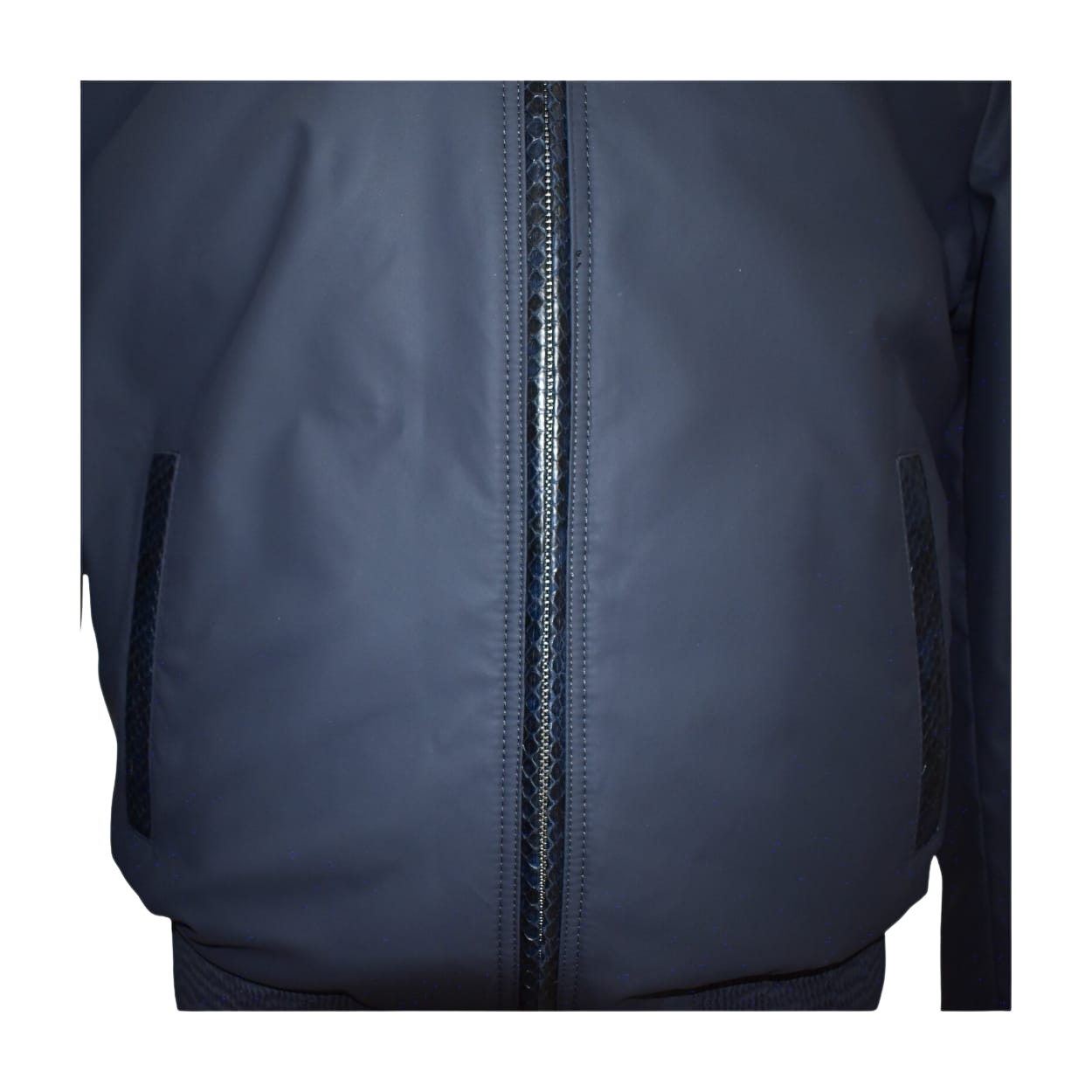 Close-up of a navy blue jacket with a zipper
