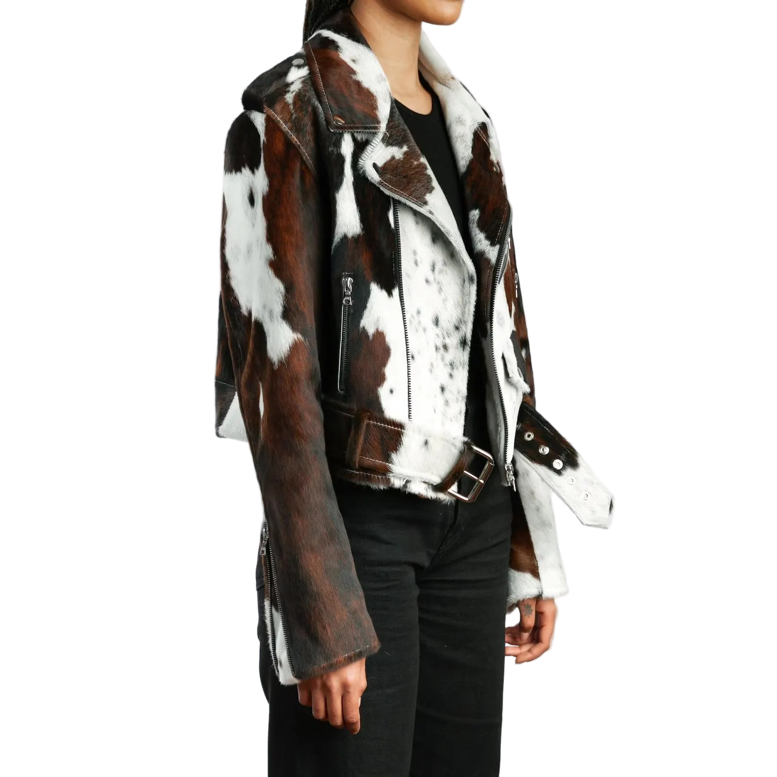 Person wearing a brown and white cowhide leather jacket