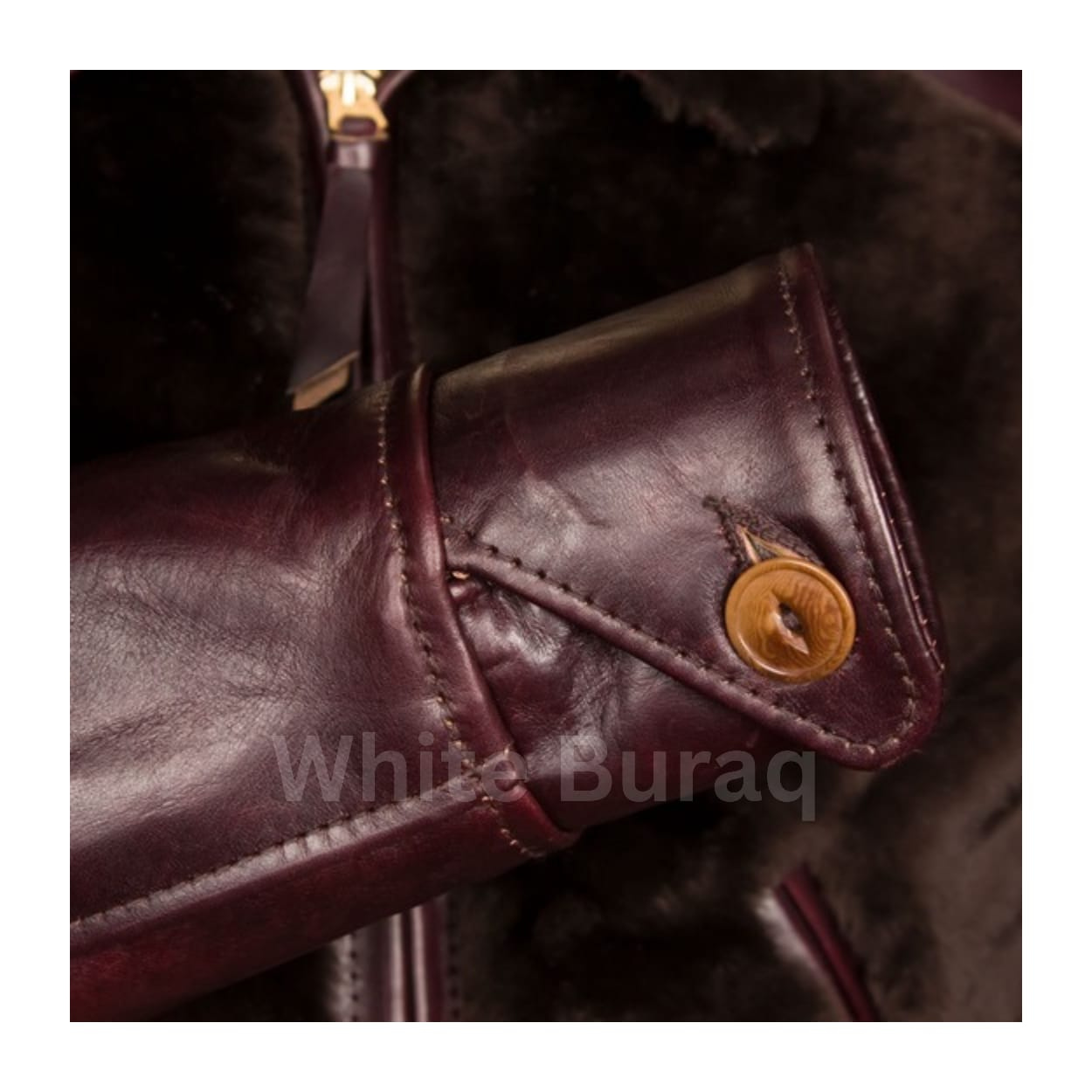 Close-up of a brown leather bag with a gold button
