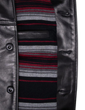 Close-up of a leather jacket with a striped sweater peeking out from underneath.