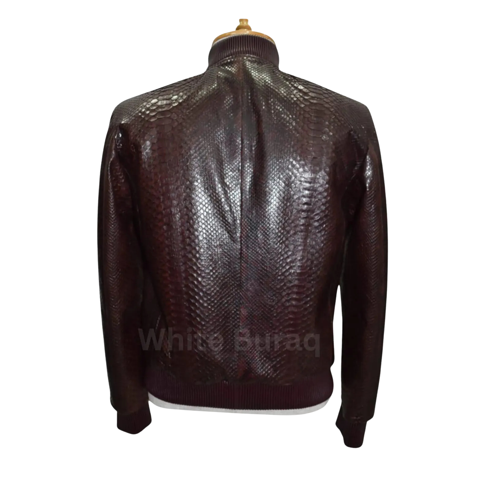 Brown leather jacket with snake skin pattern on a mannequin