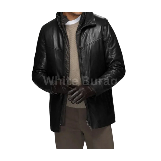 Man wearing a black leather jacket over a beige sweater