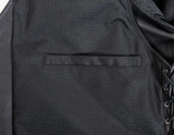 Close-up of a black jacket with a pocket and lace-up detail.