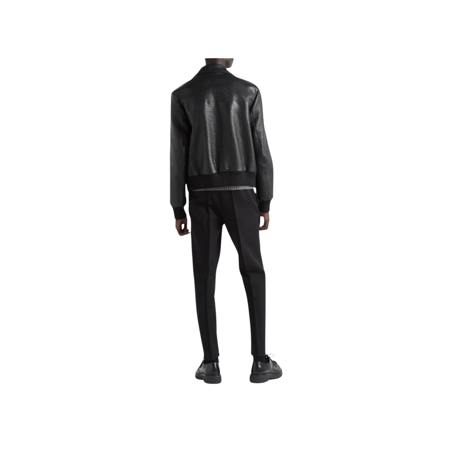 Person wearing a black leather jacket and pants