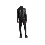 Person wearing a black leather jacket and pants