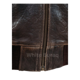 Close-up of a brown leather jacket with a zipper