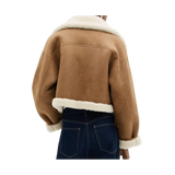 Brown jacket with white fur lining worn by a person