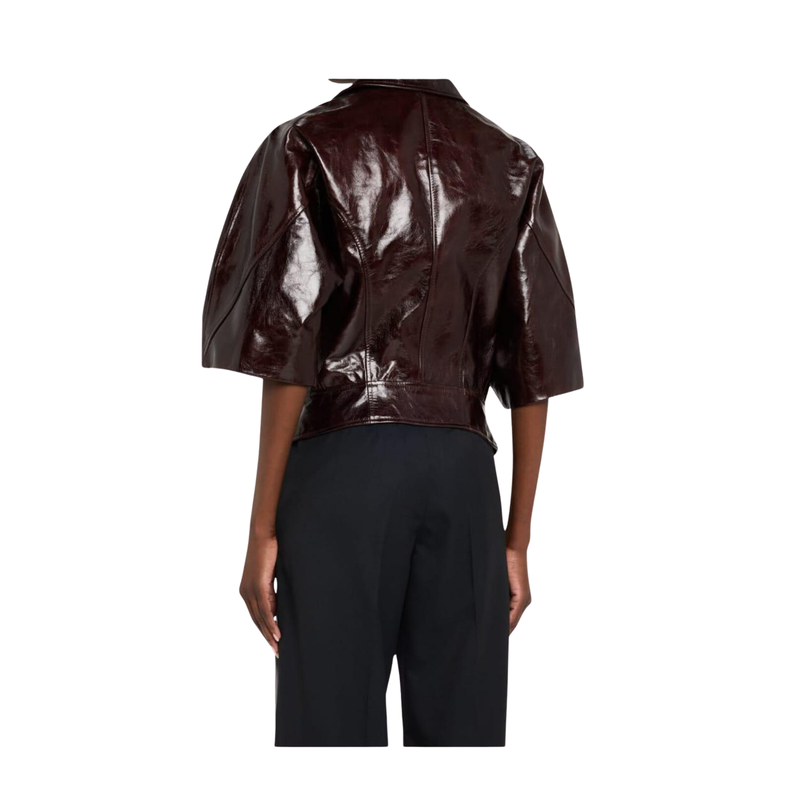 Person wearing a shiny brown jacket and black pants