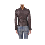 Person wearing a brown leather jacket and blue jeans