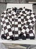 Close-up of hand-pieced black and white leather squares
