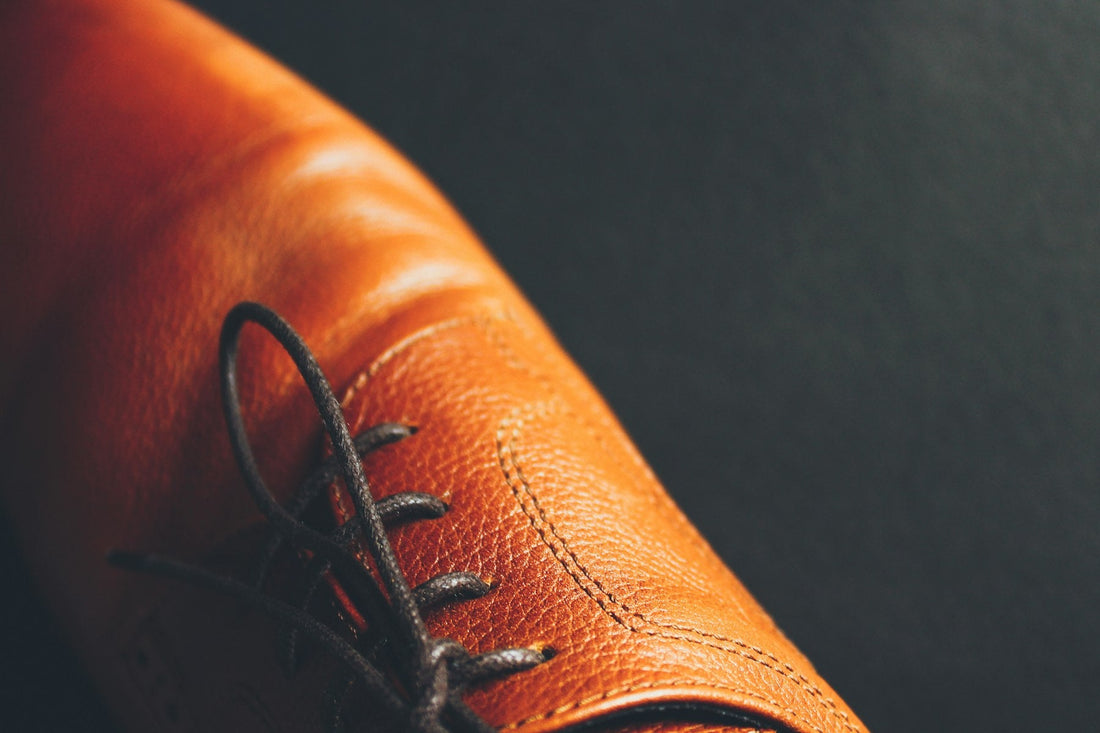Close-up of a brown leather lace-up dress shoe