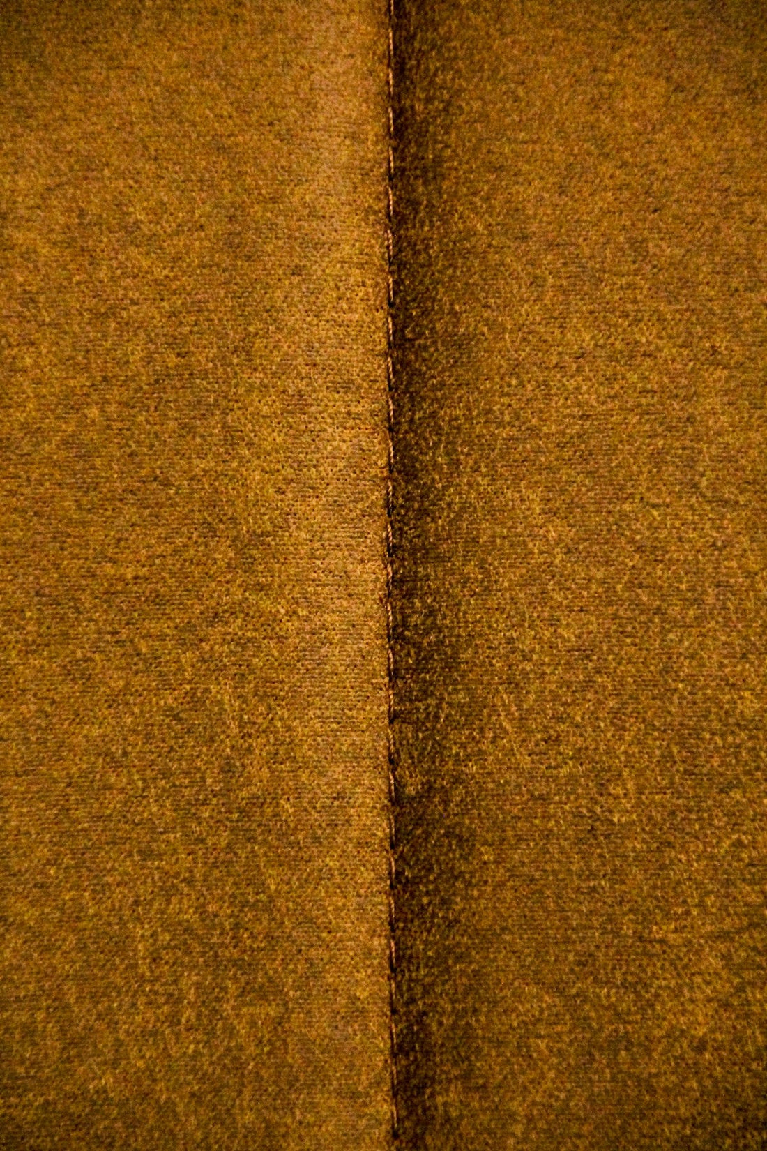Close-up of mustard leather with a velvety finish