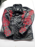 Black leather jacket with red embroidered sleeves, collar folded down