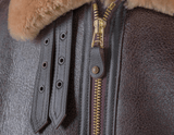 Close-up of a leather jacket with fur trim and gold zipper