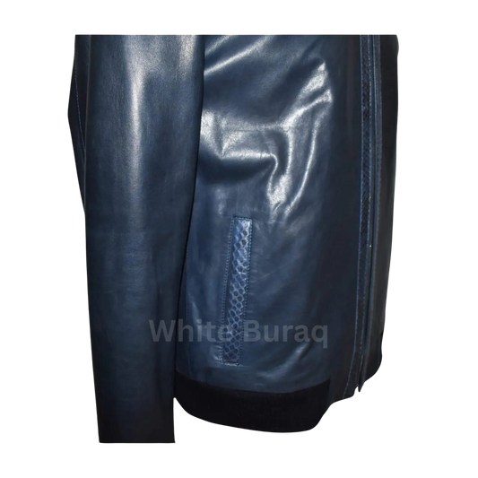Close-up of a dark blue leather jacket with a zipper