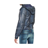 Person wearing a blue textured jacket and jeans 