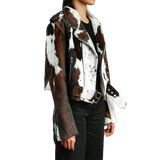Person wearing a brown and white cowhide leather jacket 