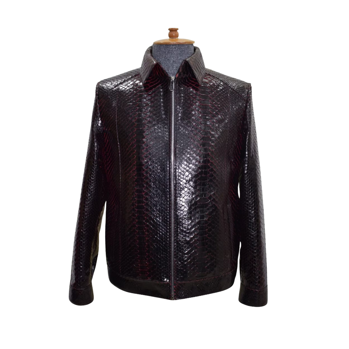 Black leather jacket with snake skin pattern on a mannequin 