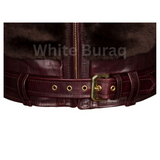 Close-up of a brown leather belt with gold buckle 