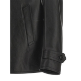 Close-up of a black leather jacket with a pocket and button detail 