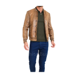 Man wearing a brown leather jacket, green shirt, and blue pants