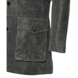 Close-up of a dark gray suede coat with a pocket
