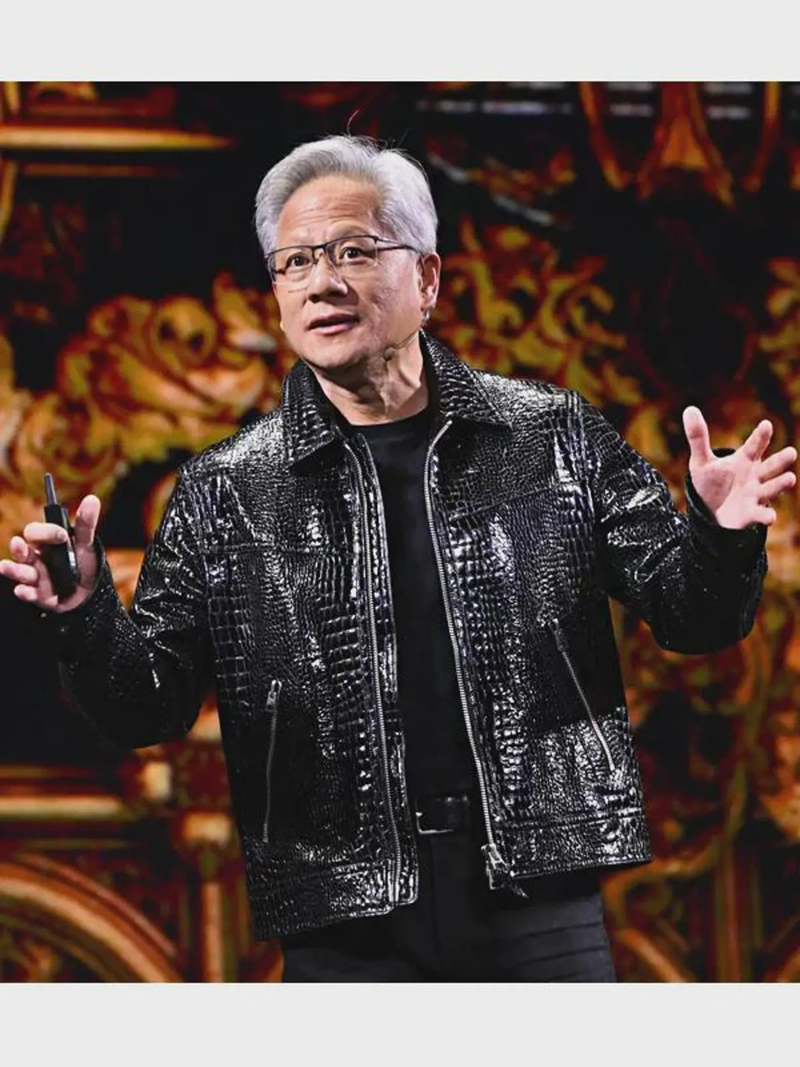 Man wearing a shiny black jacket with a colorful