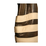 Close-up of a belt with gold and beige straps 