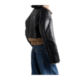 Black leather jacket with fur lining worn by a person 