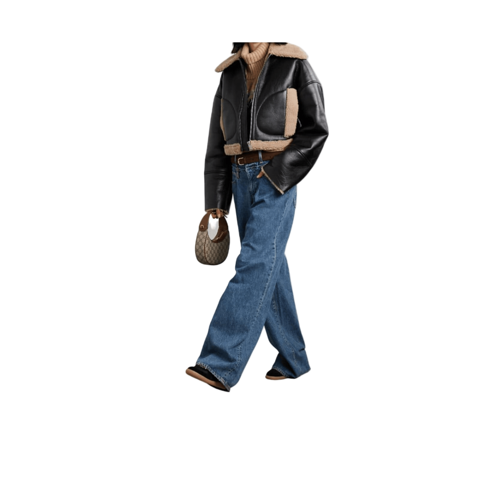 Person wearing a black leather jacket with shearling lining, blue jeans, and brown boots 