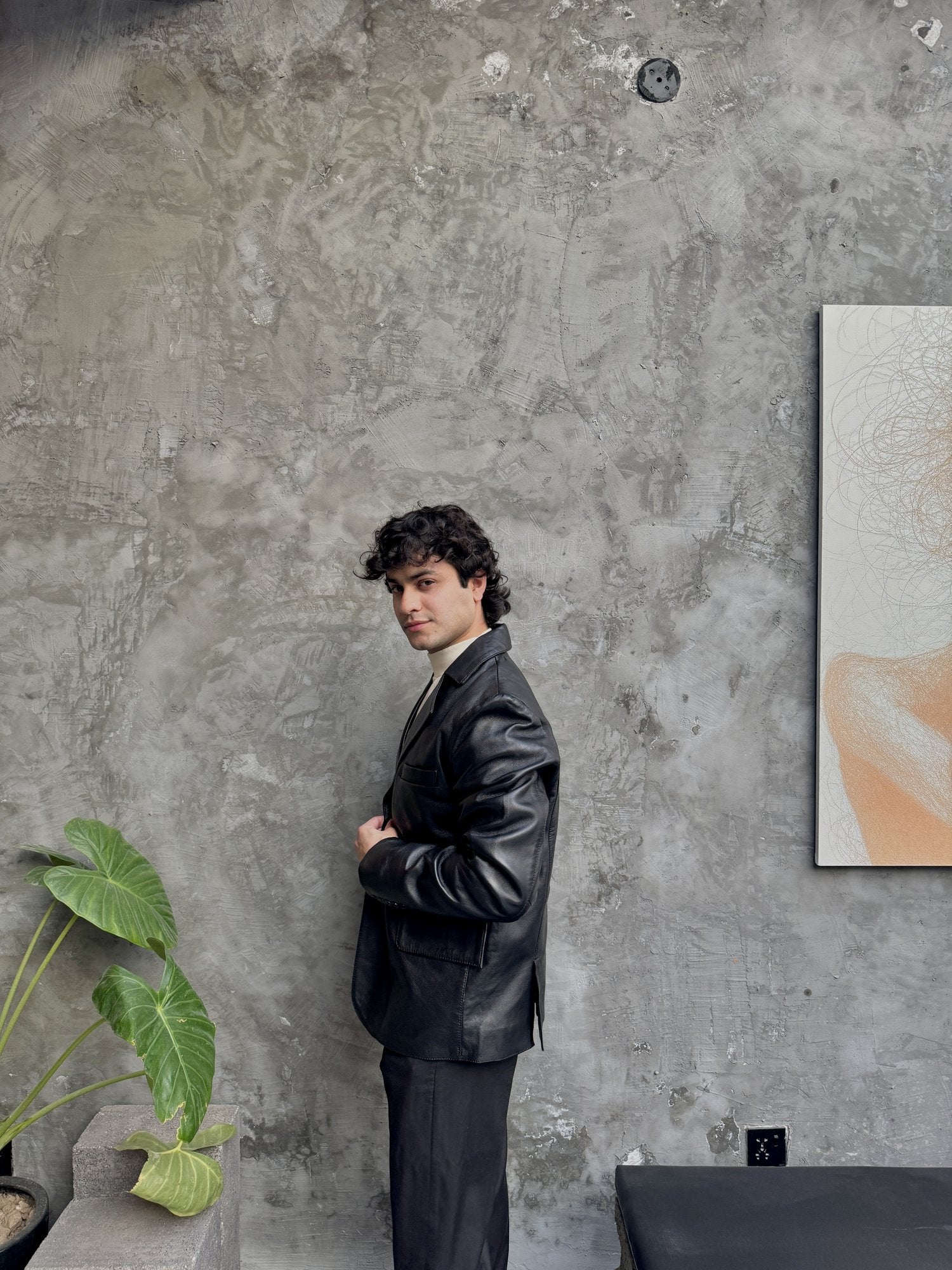 Men's Modern Leather Blazer in Black – side view on model