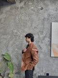 Men's Leather Two-Button Blazer in Tan – side view on model
