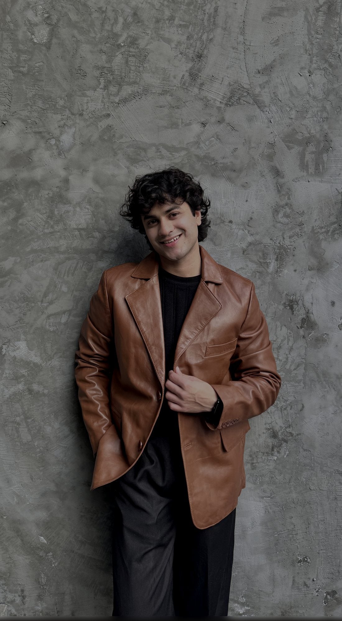 Man wearing a tan leather blazer